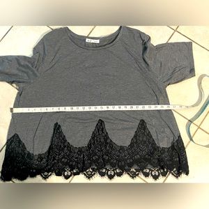 Gently used gray top three-quarter sleeve with black lace and bottom of top